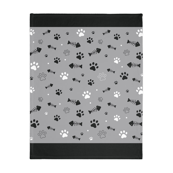 Soft and stylish polyester blanket featuring a playful pet-inspired design of paw prints and fish bones, ideal for snuggling at home or lounging outdoors