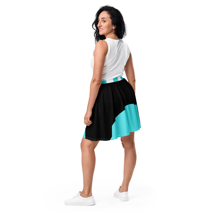 Young woman showcasing a stylish black and turquoise skater skirt with a flirty mid-thigh length and elastic waistband, ideal for sporty and casual looks.