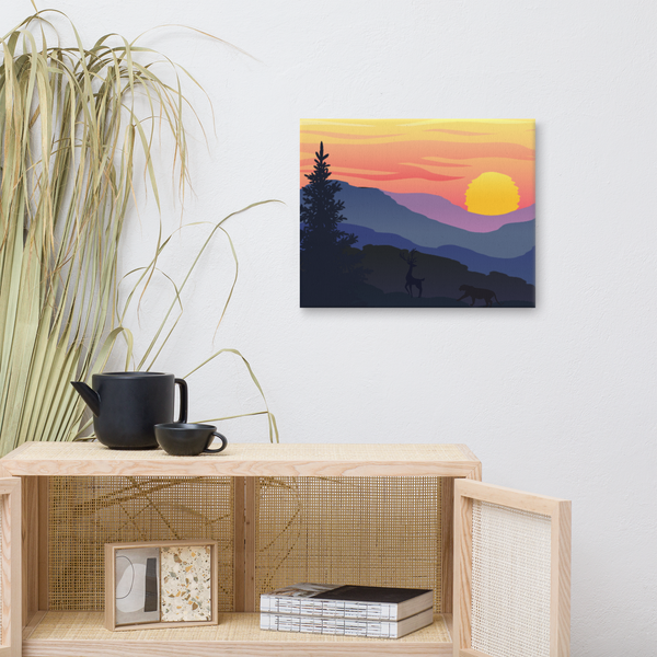 Serene sunset over layered mountain landscape with wildlife, featuring a deer and panther in silhouette against a vibrant sky on a high-quality canvas print.