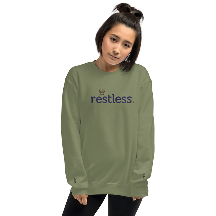 Woman wearing eco-friendly green sweatshirt, pre-shrunk with a classic fit, made from soft air-jet spun yarn, perfect for keeping warm in cooler weather.