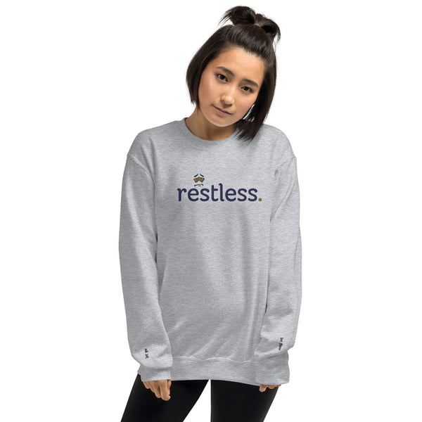 Woman wearing eco-friendly sport grey sweatshirt, pre-shrunk with a classic fit, made from soft air-jet spun yarn, perfect for keeping warm in cooler weather.