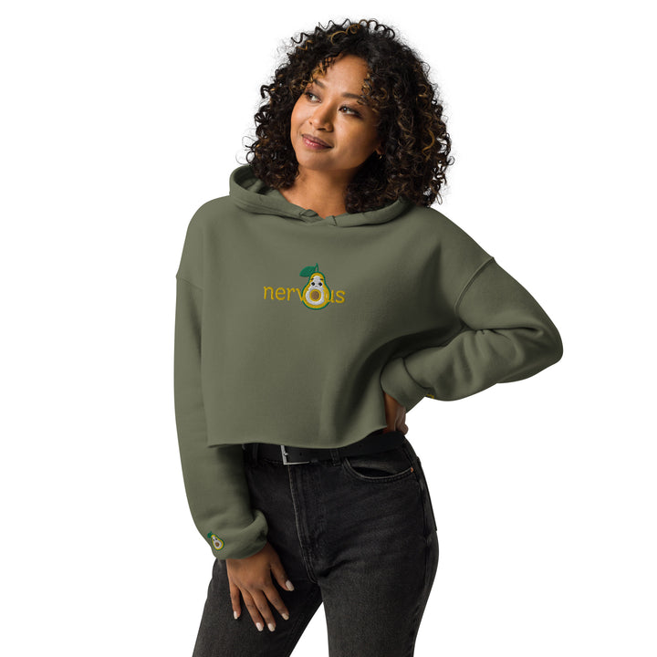 Military Green Nervous Nut' Cropped Hoodie with a raw hem, modeled in a casual setting with a focus on the comfortable fit and trendy look.