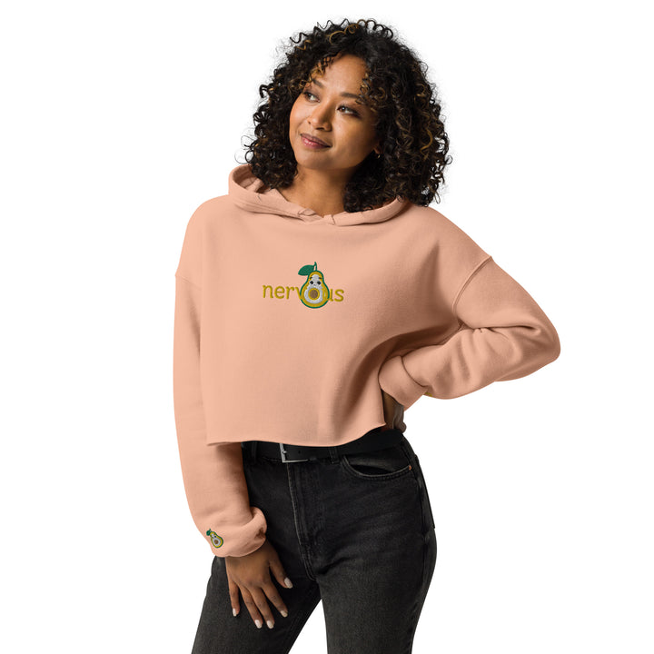 Peach Nervous Nut' Cropped Hoodie with a raw hem, modeled in a casual setting with a focus on the comfortable fit and trendy look.