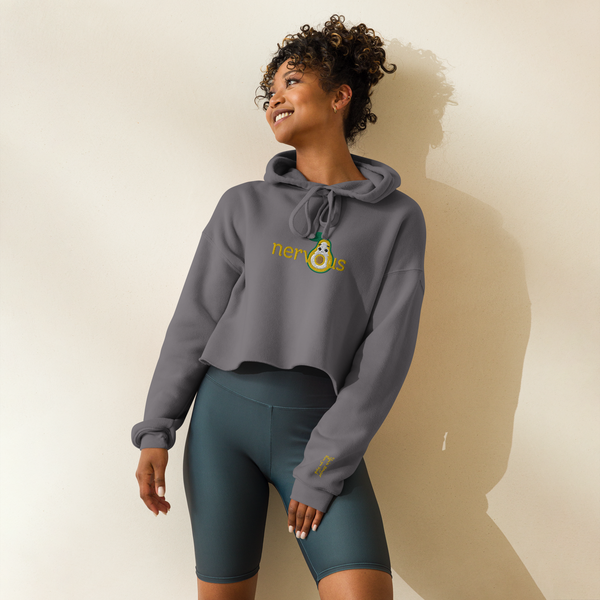 Woman showcasing the 'Nervous Nut' Cropped Hoodie, highlighting the trendy raw hem, snug drawstrings, and relaxed silhouette. 