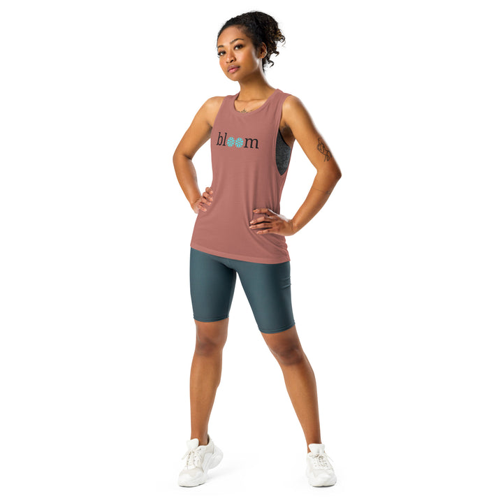 Stylish Mauve Muscle Tank with a 'bloom' design, made from sweat-wicking material, ideal for those who love to combine fitness with nature's charm. The casual yet chic design allows for a seamless transition from gym to everyday wear.